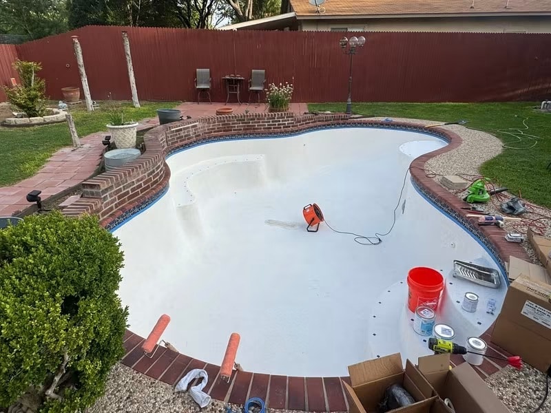 Pool covered in oak leaves before cleaning